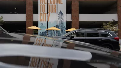 A banner with the images of the Heritage Center of Clark County and "Welcome To Our City," hangs along North Fountain Ave. Tuesday, Sept. 17, 2024, in Springfield, Ohio. (AP Photo/Carolyn Kaster)