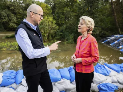 European Commmission President Ursula von der Leyen, right, talks to Jakub Mazur, First Deputy Mayor of Wroclaw, next to the river Bystrzyca near Woclaw, Poland, Thursday, Sept. 19, 2024. (Christoph Soeder/DPA via AP, Pool)