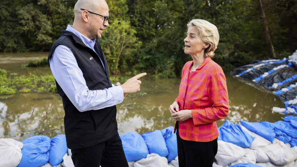 European Commmission President Ursula von der Leyen, right, talks to Jakub Mazur, First Deputy Mayor of Wroclaw, next to the river Bystrzyca near Woclaw, Poland, Thursday, Sept. 19, 2024. (Christoph Soeder/DPA via AP, Pool)