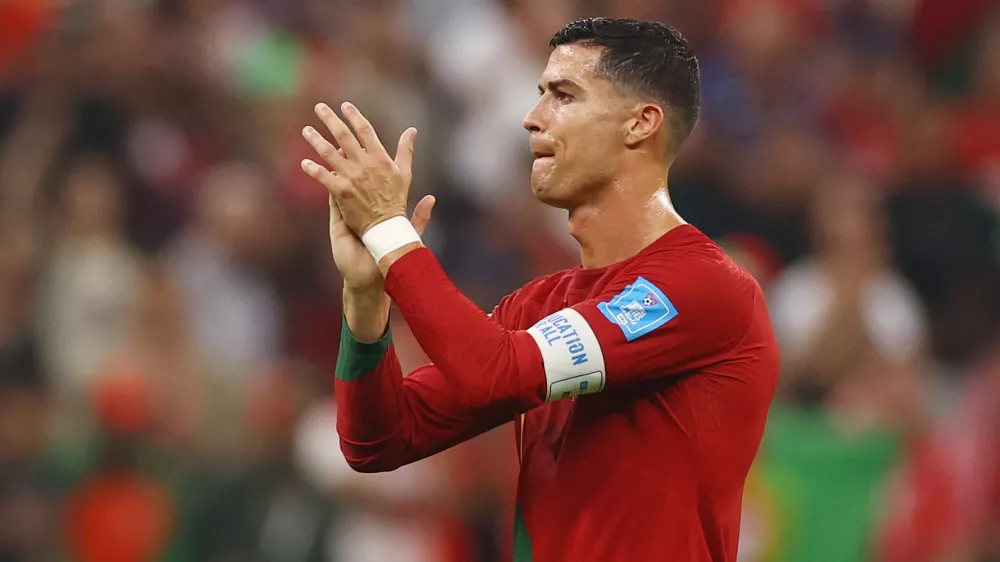 Soccer Football - FIFA World Cup Qatar 2022 - Round of 16 - Portugal v Switzerland - Lusail Stadium, Lusail, Qatar - December 6, 2022 Portugal's Cristiano Ronaldo applauds fans after qualifying for the quarter finals REUTERS/Kai Pfaffenbach REFILE - CORRECTING TEMPLATE