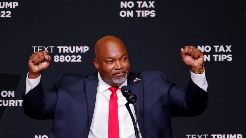 FILE PHOTO: Republican candidate for North Carolina Governor and current North Carolina Lieutenant Governor, Mark Robinson gestures as he attends a campaign event in Asheville, North Carolina, U.S. August 14, 2024. REUTERS/Jonathan Drake/File Photo