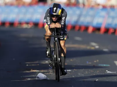 Primoz Roglic, of Slovenia, competes in the first stage of the tour of Spain, La Vuelta, cycling race, an individual time trial with start in Lisbon and finish in Oeiras, Portugal, Saturday, Aug. 17, 2024. (AP Photo/Pedro Rocha)