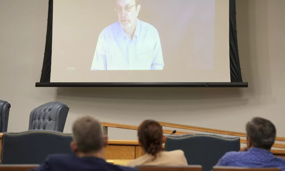 Steven Ross, former OceanGate scientific director, top, speaks via video link as he testifies during the Titan marine board formal hearing inside the Charleston County Council Chambers, Thursday, Sept. 19, 2024, in North Charleston, S.C. (Corey Connor via AP, Pool)