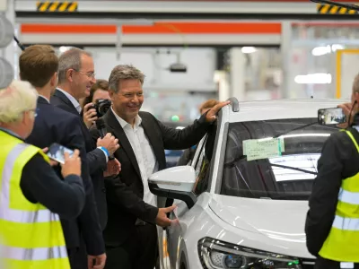 German Economy Minister Robert Habeck poses beside a Volkswagen car during his visit at a Volkswagen plant in Emden, Germany September 20, 2024. REUTERS/Fabian Bimmer