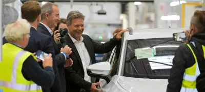 German Economy Minister Robert Habeck poses beside a Volkswagen car during his visit at a Volkswagen plant in Emden, Germany September 20, 2024. REUTERS/Fabian Bimmer