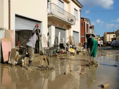 People clean up, following floods triggered by severe weather, in Traversara, Emilia-Romagna, Italy, September 20, 2024. REUTERS/Ciro de Luca