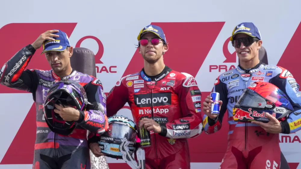 Race winner Italian rider Enea Bastianini of the Ducati Lenovo Team, center, poses on the podium with second placed Spain's rider Jorge Martin of the Prima Pramac Racing, left, and third placed Spain's rider Marc Marquez of the Gresini Racing MotoGP after the MotoGP race of the Emilia Romagna Motorcycle Grand Prix at the Misano circuit in Misano Adriatico, Italy, Sunday, Sept. 22, 2024. (AP Photo/Gregorio Borgia)