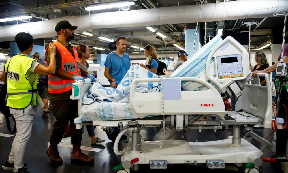 Medical staff move a bed of a patient to an underground emergency hospital in a parking lot at Rambam Health Care Campus, amid cross-border hostilities between Hezbollah and Israel, in Haifa, Israel September 22, 2024. REUTERS/Shir Torem