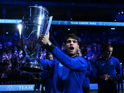 Tennis - Laver Cup - Uber Arena, Berlin, Germany - September 22, 2024 Team Europe's Carlos Alcaraz celebrates with the trophy after winning the Laver Cup REUTERS/Annegret Hilse