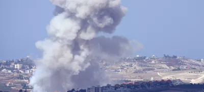 Smoke rises from Israeli airstrikes on villages in the Nabatiyeh district, seen from the southern town of Marjayoun, Lebanon, Monday, Sept. 23, 2024.(AP Photo/Hussein Malla)