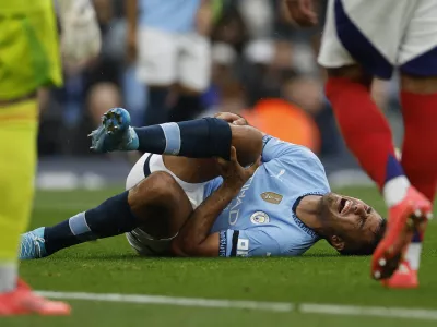 Soccer Football - Premier League - Manchester City v Arsenal - Etihad Stadium, Manchester, Britain - September 22, 2024 Manchester City's Rodri reacts after sustaining an injury Action Images via Reuters/Jason Cairnduff EDITORIAL USE ONLY. NO USE WITH UNAUTHORIZED AUDIO, VIDEO, DATA, FIXTURE LISTS, CLUB/LEAGUE LOGOS OR 'LIVE' SERVICES. ONLINE IN-MATCH USE LIMITED TO 120 IMAGES, NO VIDEO EMULATION. NO USE IN BETTING, GAMES OR SINGLE CLUB/LEAGUE/PLAYER PUBLICATIONS. PLEASE CONTACT YOUR ACCOUNT REPRESENTATIVE FOR FURTHER DETAILS..