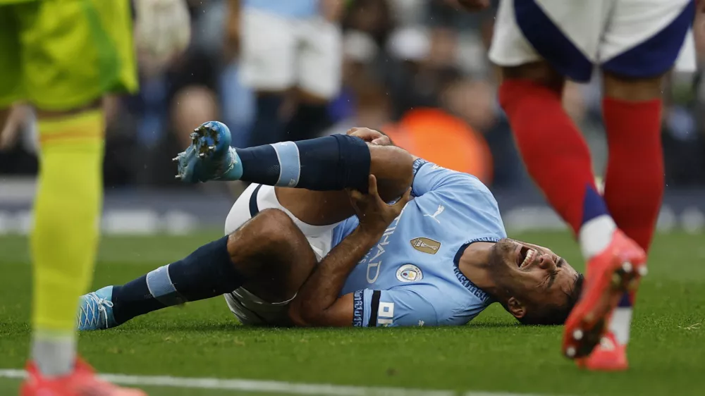 Soccer Football - Premier League - Manchester City v Arsenal - Etihad Stadium, Manchester, Britain - September 22, 2024 Manchester City's Rodri reacts after sustaining an injury Action Images via Reuters/Jason Cairnduff EDITORIAL USE ONLY. NO USE WITH UNAUTHORIZED AUDIO, VIDEO, DATA, FIXTURE LISTS, CLUB/LEAGUE LOGOS OR 'LIVE' SERVICES. ONLINE IN-MATCH USE LIMITED TO 120 IMAGES, NO VIDEO EMULATION. NO USE IN BETTING, GAMES OR SINGLE CLUB/LEAGUE/PLAYER PUBLICATIONS. PLEASE CONTACT YOUR ACCOUNT REPRESENTATIVE FOR FURTHER DETAILS..