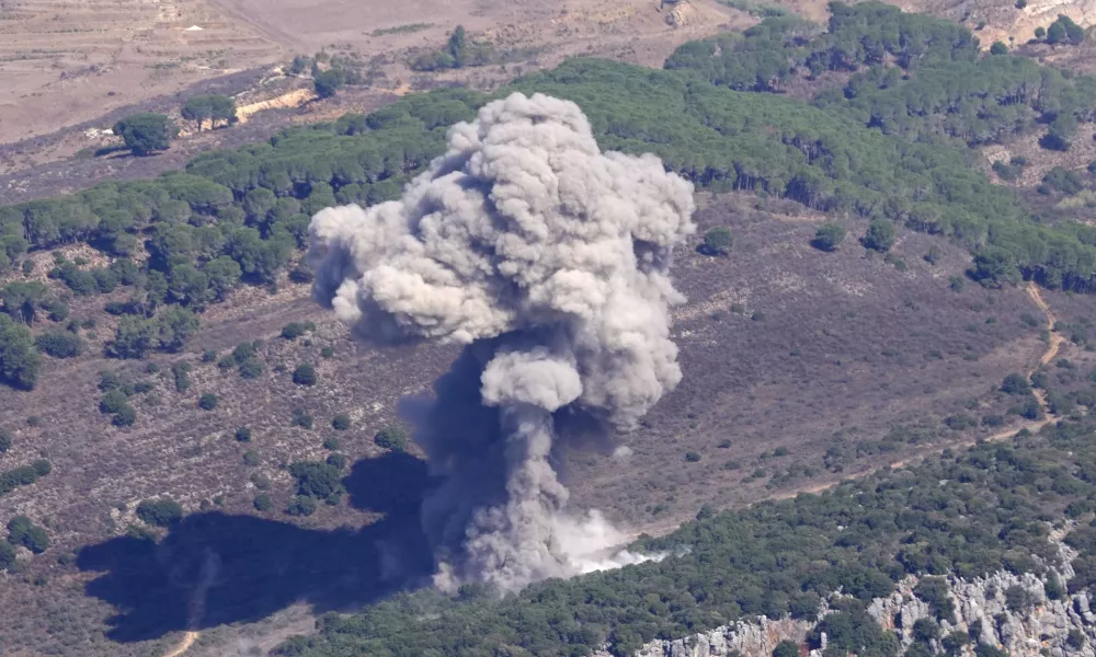 Smoke rises from an Israeli airstrike on the Mahmoudieh mountain, as seen from Marjayoun town, south Lebanon, Tuesday, Sept. 24, 2024. (AP Photo/Hussein Malla)