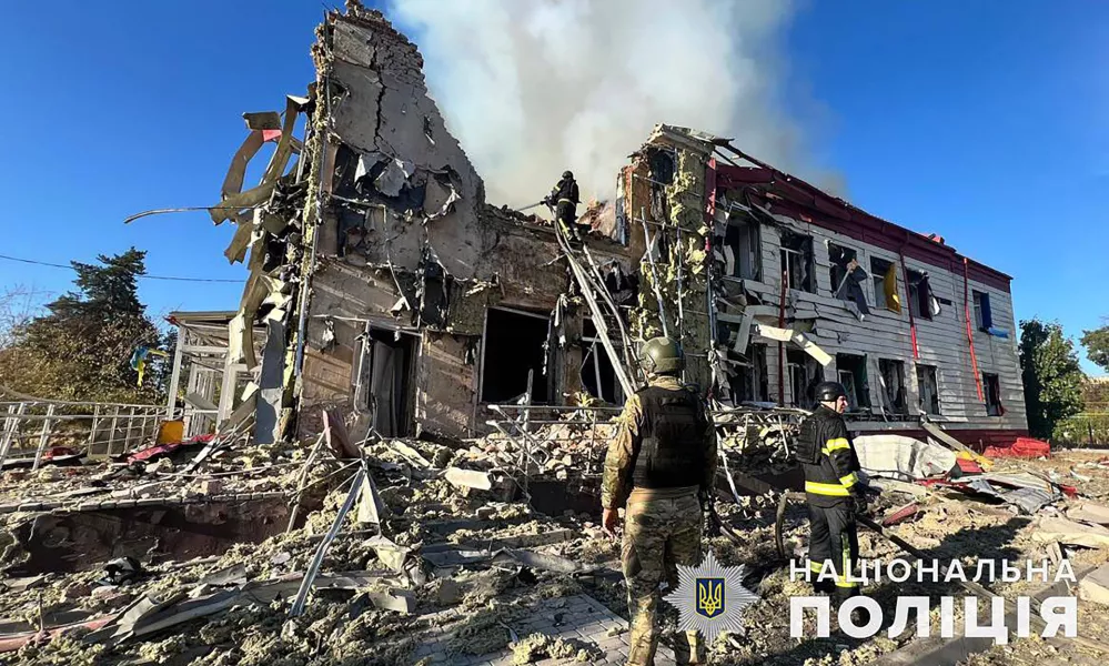 A firefighter extinguishes a fire on a damaged building after a Russian attack in the Donetsk region of Ukraine, Tuesday Sept. 24, 2024. (Ukraine National Police via AP)