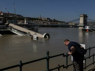 A man looks at the Danube River during flooding in Budapest, Hungary, September 21, 2024. REUTERS/Marko Djurica