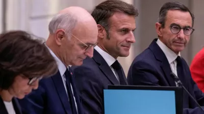 FILE PHOTO: French President Emmanuel Macron is flanked by new Justice Minister Didier Migaud and new Interior Minister Bruno Retailleau during the first weekly cabinet meeting at the Elysee Palace Monday, Sept. 23, 2024 in Paris, France.   Christophe Ena/Pool via REUTERS/File Photo