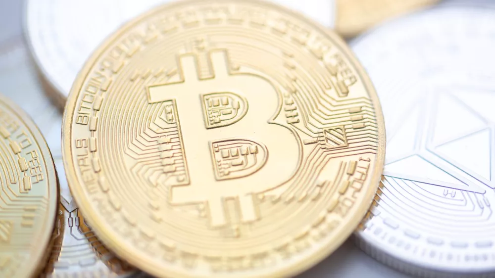 FILED - 10 November 2023, Berlin: Bitcoin (M) and Ethereum coins are arranged on a table. Photo: Fernando Gutierrez-Juarez/dpa