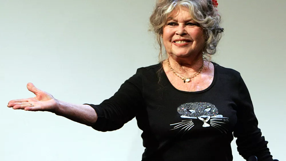 Former French film star and animal right activist Brigitte Bardot acknowledges applause prior to a press conference at the Marigny theater, in Paris, on the 20th anniversary of her foundation for animal rights, The Brigitte Bardot Foundation, Thursday Sept. 28, 2006. (AP Photo/Remy de la Mauviniere)