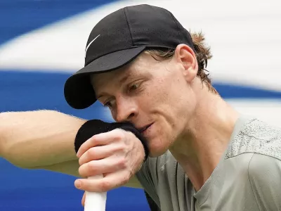 FILE - Jannik Sinner, of Italy, wipes sweat from his face between serves to Mackenzie McDonald, of the United States, during the first round of the U.S. Open tennis championships, Tuesday, Aug. 27, 2024, in New York. (AP Photo/Kirsty Wigglesworth, File)