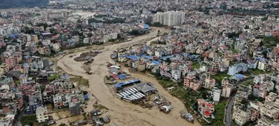 In this aerial image of the Kathmandu valley, Bagmati River is seen in flood due to heavy rains in Kathmandu, Nepal, Saturday, Sept. 28, 2024. (AP Photo/Gopen Rai)