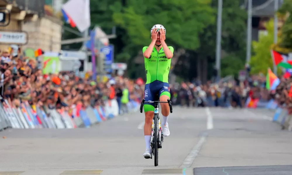 Cycling - UCI World Championships 2024 - Men's Elite Road Race - Zurich, Switzerland - September 29, 2024 Slovenia's Tadej Pogacar celebrates winning the race REUTERS/Denis Balibouse