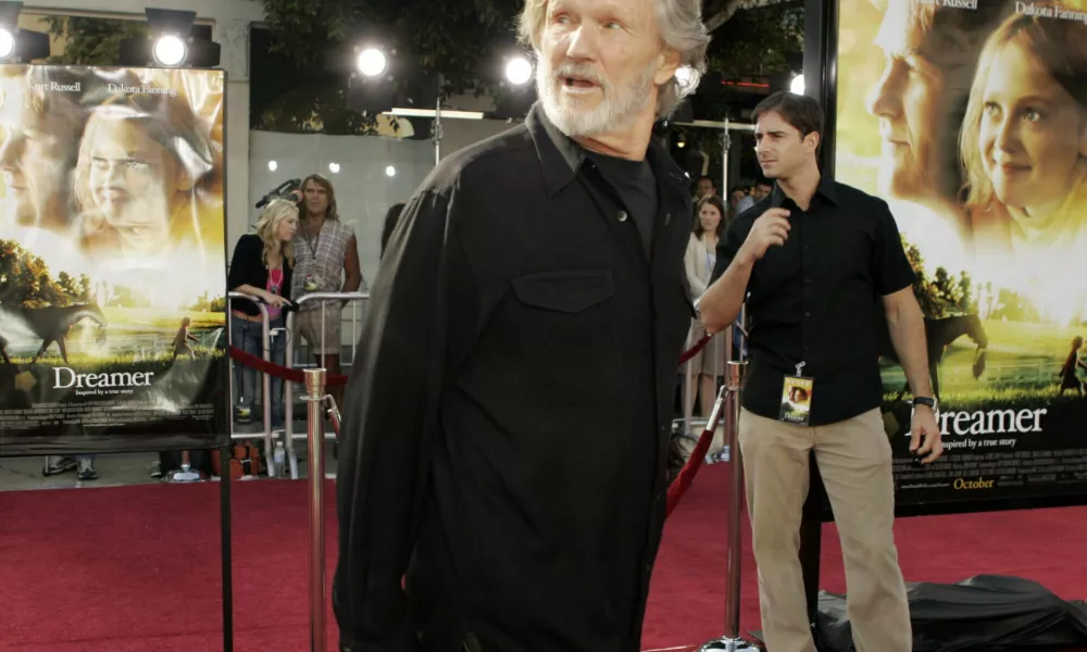 FILE - Actor Kris Kristofferson walks down the red carpet during the premiere for his new movie "Dreamer," Oct. 9, 2005, in the Westwood section of Los Angeles. (AP Photo/Ric Francis, File)