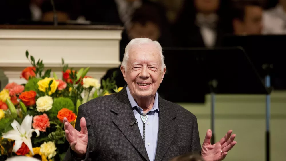 FILE - Former President Jimmy Carter teaches Sunday School class at the Maranatha Baptist Church in his hometown of Plains, Ga., Aug. 23, 2015. (AP Photo/David Goldman, File)