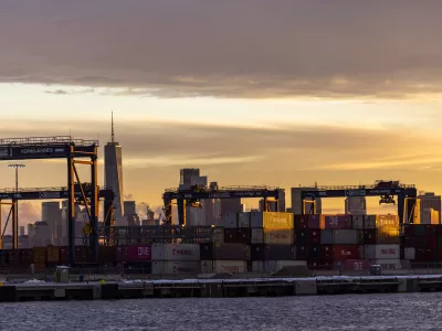 Cranes and shipping containers are seen at Port Jersey with the New York City skyline in the background during a port strike, Tuesday, Oct. 1, 2024, in Bayonne. (AP Photo/Eduardo Munoz Alvarez)