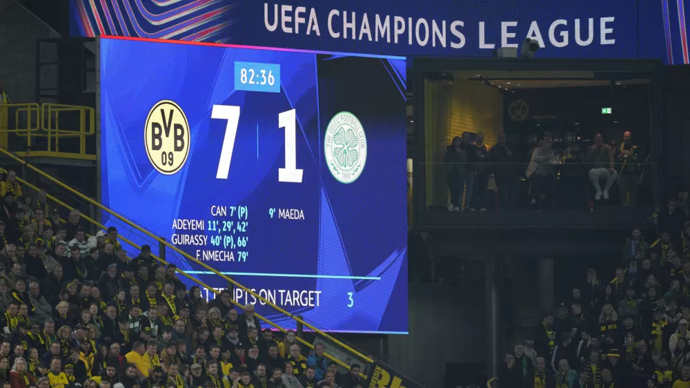 Dortmund fans watch the Champions League opening phase soccer match between Borussia Dortmund and Celtic FC at the BVB Stadion in Dortmund, Germany, Tuesday, Oct. 1, 2024. Dortmund won 7-1. (AP Photo/Martin Meissner)