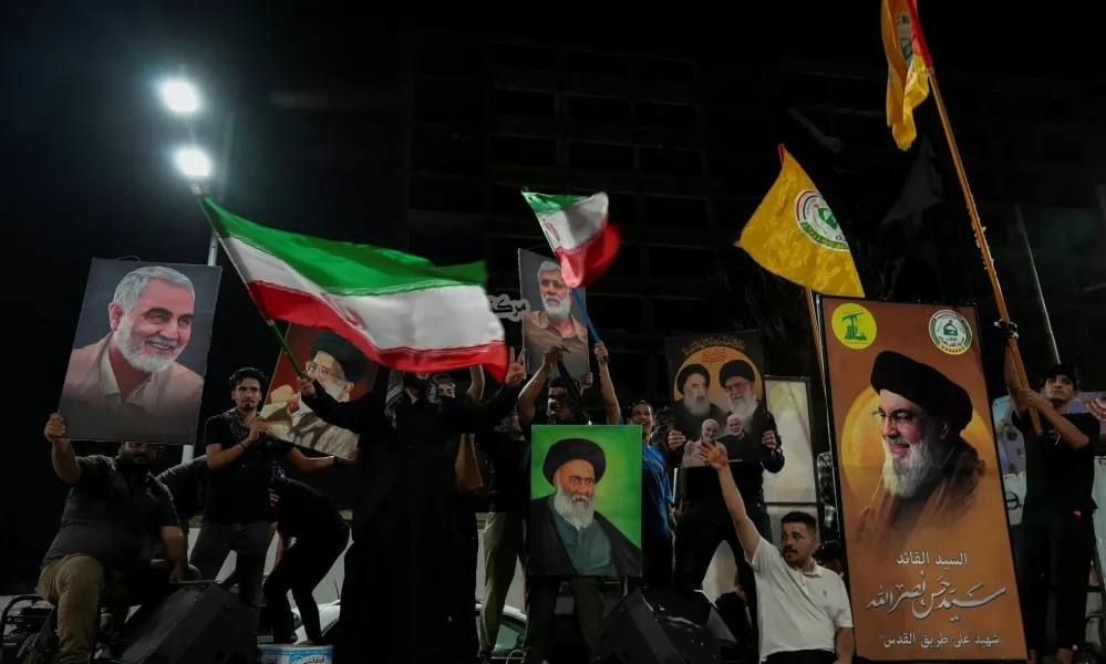 Iraqi people celebrate on a street, after the IRGC attack on Israel, in Basra, Iraq, October 1, 2024. REUTERS/Essam Al-sudani