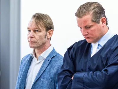 A man, who is a suspect in the disappearance of British toddler Madeleine McCann in Portugal, stands next to his lawyer Friedrich Fuelscher at his trial on unrelated sexual assault charges in Braunschweig, Germany, October 2, 2024. Christian B., is charged with three counts of aggravated rape and two counts of sexual abuse of children in Portugal between June 2007 and December 2000.   Moritz Frankenberg/Pool via REUTERS