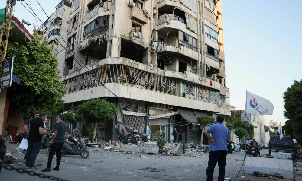 A man looks at a damaged building at the site of an Israeli strike on central Beirut's Bachoura neighbourhood, amid ongoing hostilities between Hezbollah and Israeli forces, in Beirut, Lebanon October 3, 2024. REUTERS/Emilie Madi