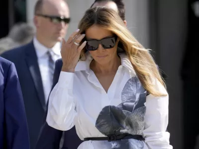 FILE - Former first lady Melania Trump leaves after voting in the Florida primary election in Palm Beach, Fla., March 19, 2024. Melania Trump is not expected to speak at next week's Republican National Convention, which will feature speeches by other Trump family members and a long list of GOP officials. The former first lady will attend the convention, but does not appear on a list of  headliners and keynote speakers released by convention organizers Saturday, July 13. (AP Photo/Wilfredo Lee, File)