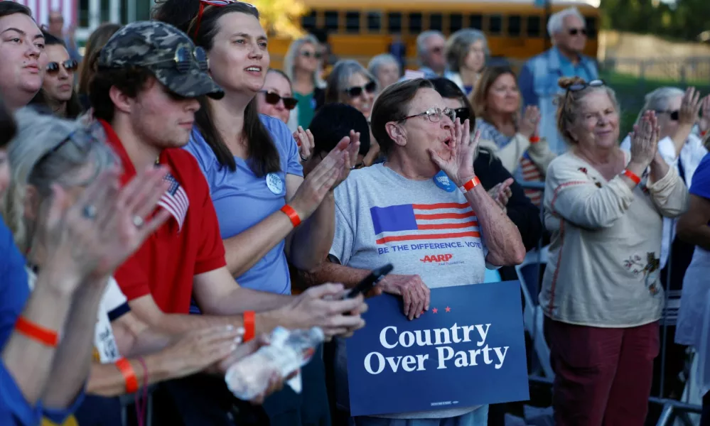 People attend a campaign event hold by Democratic presidential nominee and U.S. Vice President Kamala Harris and former Congresswoman Liz Cheney (R-WY), in Ripon, Wisconsin, U.S., October 3, 2024. REUTERS/Evelyn Hockstein