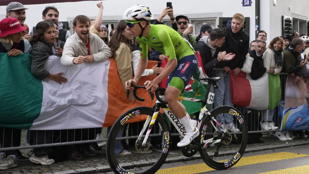 Slovenia's Tadej Pogacar attacks during the Men Elite road race of the Cycling and Para-cycling Road World Championships in Zurich, Switzerland, Sunday, Sept. 29, 2024. (AP Photo/Peter Dejong)