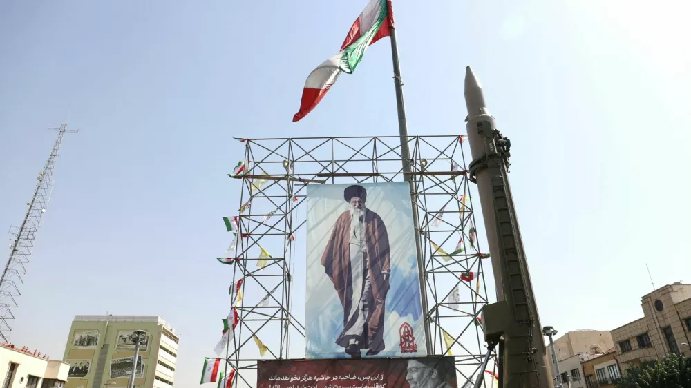 FILE PHOTO: An Iranian missile system is displayed next to a banner with a picture of Iran's Supreme Leader Ayatollah Ali Khamenei and the late Lebanon's Hezbollah leader Hassan Nasrallah, in a street in Tehran, Iran, October 2, 2024. Majid Asgaripour/WANA (West Asia News Agency) via REUTERS ATTENTION EDITORS - THIS IMAGE HAS BEEN SUPPLIED BY A THIRD PARTY/File Photo