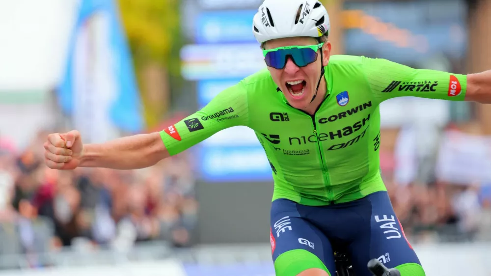 Cycling - UCI World Championships 2024 - Men's Elite Road Race - Zurich, Switzerland - September 29, 2024 Slovenia's Tadej Pogacar celebrates winning the race REUTERS/Denis Balibouse