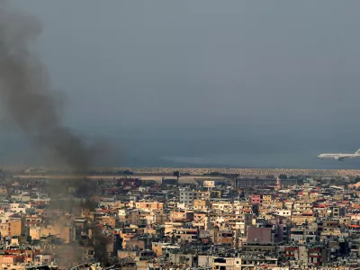 06 October 2024, Lebanon, Beirut: A Georgian plane lands at the tarmac of Beirut International Airport to evacuate foreign nations amid black smoke billowing from Beirut southern, a stronghold of pro-Iranian Hezbollah. Photo: Marwan Naamani/dpa