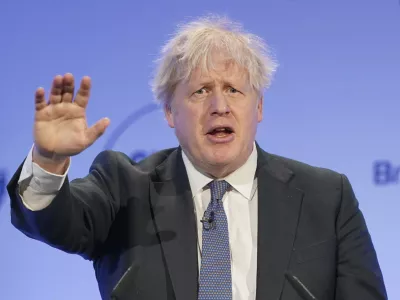 Former British Prime Minister Boris Johnson speaks during the Global Soft Power Summit, at the Queen Elizabeth II Conference Centre in London, Thursday March 2, 2023. Johnson on Thursday poured cold water on current premier Rishi Sunak's new Brexit deal with the European Union, saying he would "find it hard" to vote for it in Parliament. (Jonathan Brady/PA via AP)