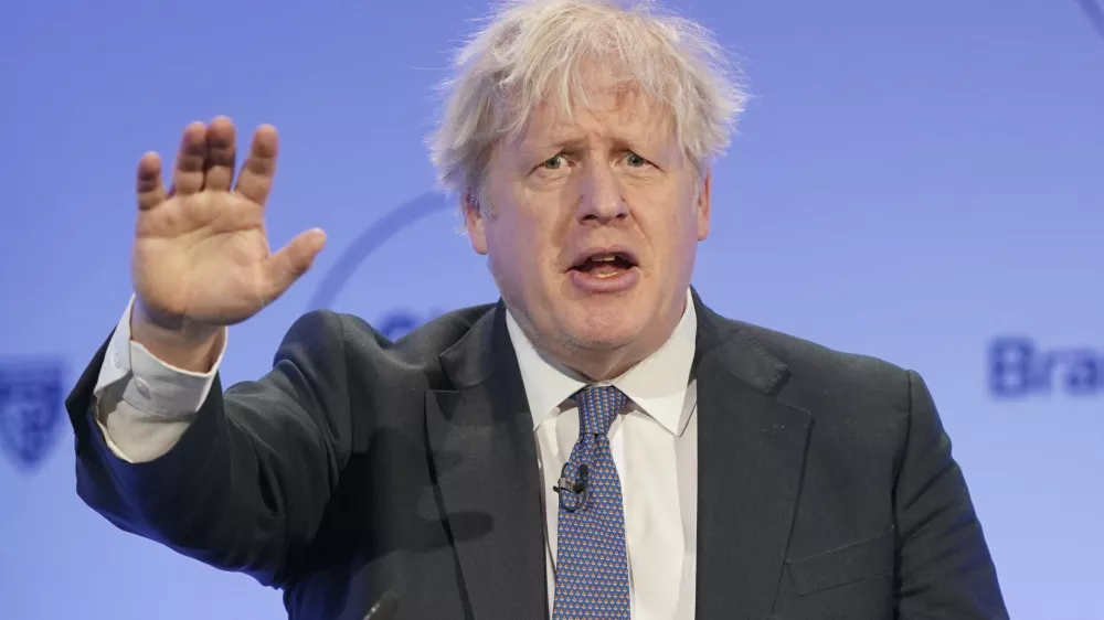 Former British Prime Minister Boris Johnson speaks during the Global Soft Power Summit, at the Queen Elizabeth II Conference Centre in London, Thursday March 2, 2023. Johnson on Thursday poured cold water on current premier Rishi Sunak's new Brexit deal with the European Union, saying he would "find it hard" to vote for it in Parliament. (Jonathan Brady/PA via AP)