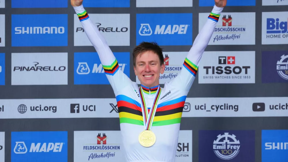 Cycling - UCI World Championships 2024 - Men's Elite Road Race - Zurich, Switzerland - September 29, 2024 Gold medallist Slovenia's Tadej Pogacar celebrates on the podium REUTERS/Denis Balibouse