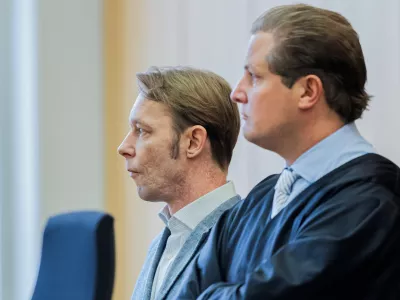 A man, who is a suspect in the disappearance of British toddler Madeleine McCann in Portugal, and his lawyer Friedrich Fuelscher wait for the verdict in a trial on unrelated sexual assault charges in Braunschweig, Germany, October 8, 2024. Christian B., is charged with three counts of aggravated rape and two counts of sexual abuse of children in Portugal between June 2007 and December 2000.   Michael Matthey/Pool via REUTERS