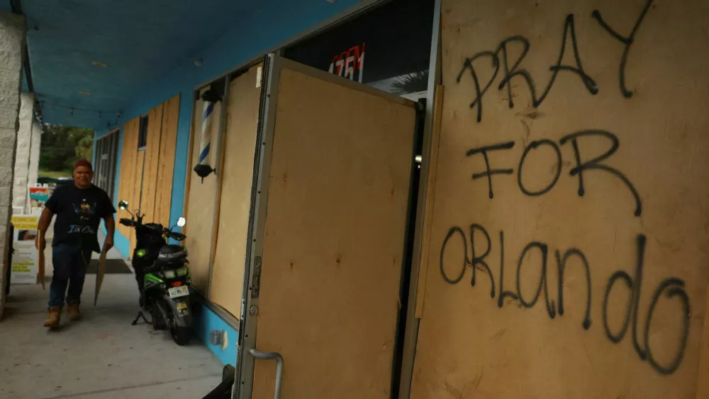 "Pray for Orlando" reads on wood that was placed at a Home Depot before the arrival of Hurricane Milton, in Orlando, Florida, U.S. October 8, 2024. REUTERS/Jose Luis Gonzalez