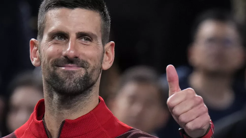 Novak Djokovic of Serbia gestures to his supporters after defeating Flavio Cobolli of Italy in the men's singles third round match of the Shanghai Masters tennis tournament at Qizhong Forest Sports City Tennis Center in Shanghai, China, Tuesday, Oct. 8, 2024. (AP Photo/Andy Wong)