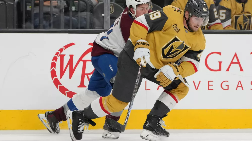 Oct 9, 2024; Las Vegas, Nevada, USA; Vegas Golden Knights center Ivan Barbashev (49) skates against Colorado Avalanche center Calum Ritchie (71) during the third period at T-Mobile Arena. Mandatory Credit: Lucas Peltier-Imagn Images