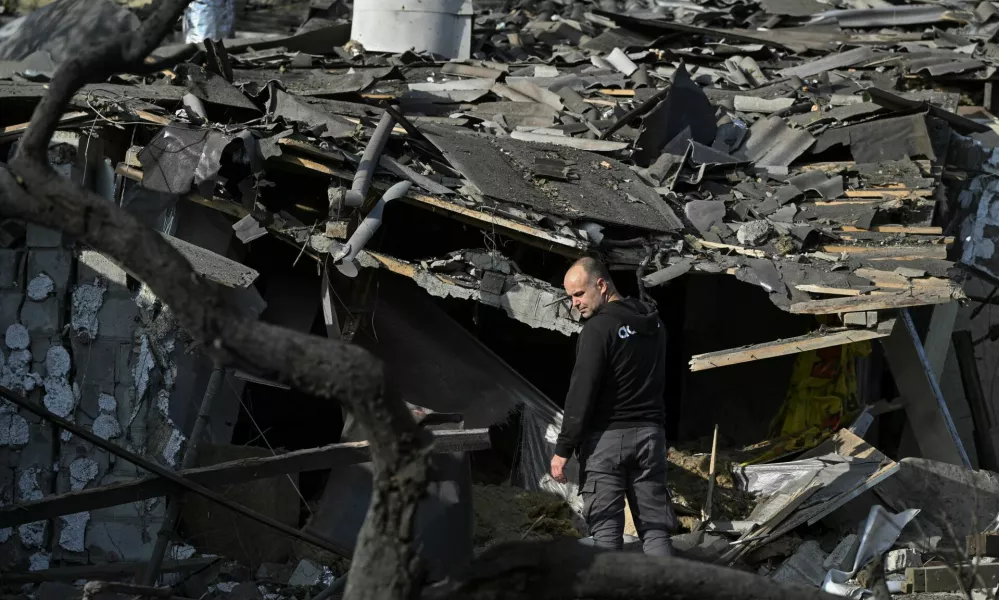 A man stands next to his house destroyed by a Russian air strike, amid Russia's attack on Ukraine, in Zaporizhzhia, Ukraine October 10, 2024. REUTERS/Stringer