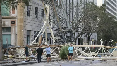 A construction crane fell over into an office building that houses the Tampa Bay Times headquarters, after Hurricane Milton, Thursday, Oct. 10, 2024. (Tampa Bay Times via AP)