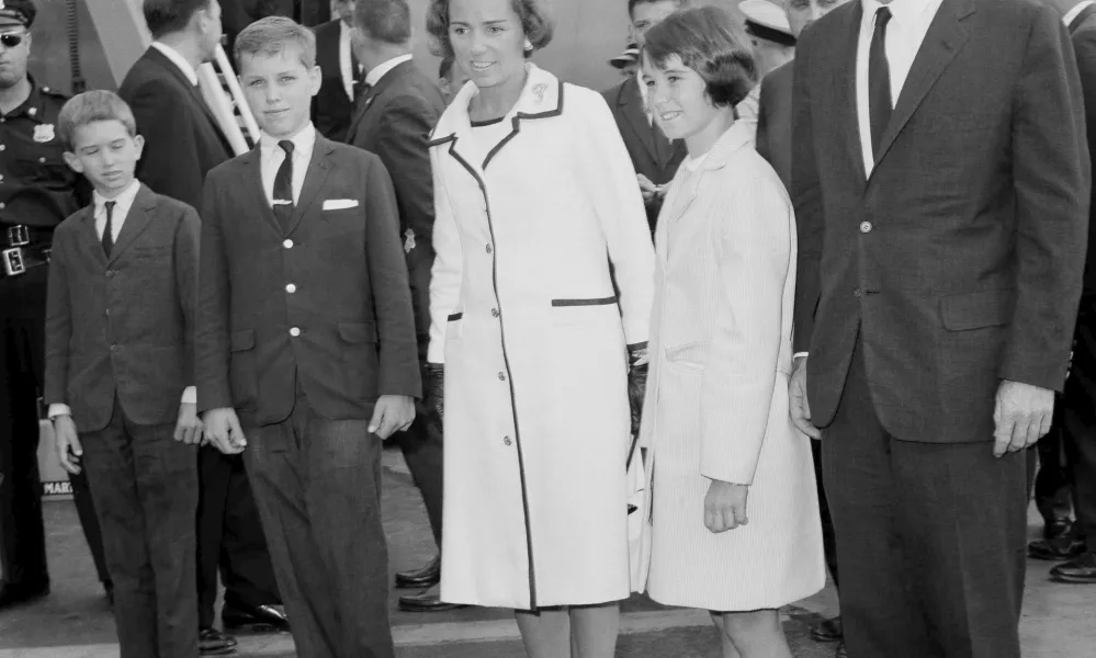 FILE - Attorney General Robert F. Kennedy, right, wife Ethel Kennedy, and children, from left, Bobby, Joseph, and Kathleen, second right, pose at Kennedy International Airport in New York, July 1, 1964, shortly after they returned from a one-week trip to West Germany and Poland. (AP Photo/Matty Zimmerman, File)