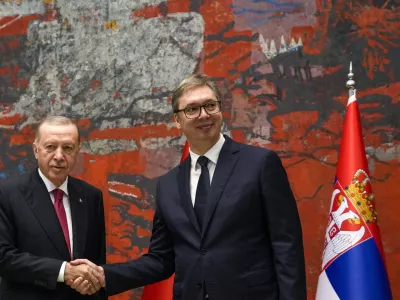 Turkey's President Recep Tayyip Erdogan, left, shakes hands with his Serbian counterpart Aleksandar Vucic during their meeting in Belgrade, Serbia, Friday, Oct. 11, 2024. (AP Photo/Darko Vojinovic)