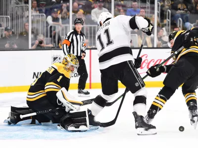 Oct 12, 2024; Boston, Massachusetts, USA; Los Angeles Kings center Anze Kopitar (11) looks for a rebound in front of Boston Bruins goaltender Jeremy Swayman (1) during the second period at TD Garden. Mandatory Credit: Bob DeChiara-Imagn Images